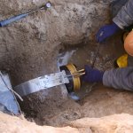 Man working on sewer line